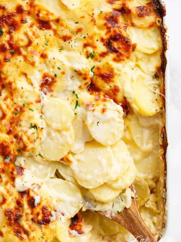 Garlic Parmesan Scalloped Potatoes layered in a creamy garlic sauce with parmesan and mozzarella