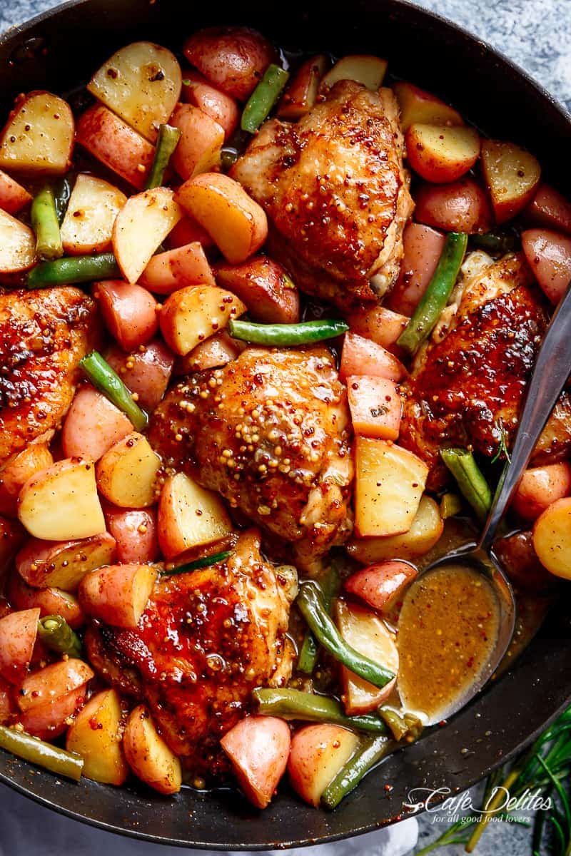Honey Mustard Chicken & Potatoes is all made in one pan! Juicy, succulent chicken pieces are cooked in the best honey mustard sauce, surrounded by green beans and potatoes for a complete meal! | https://cafedelites.com
