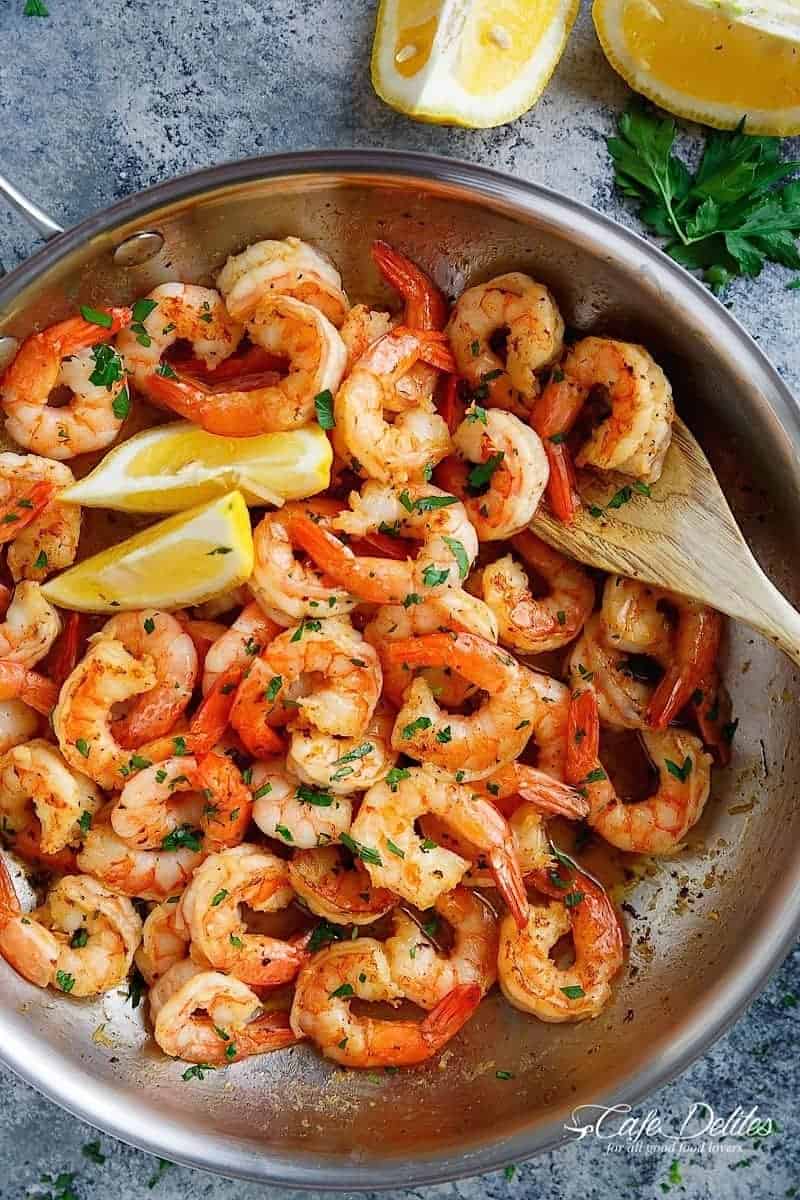 Lemon Garlic Butter Shrimp is the most easiest and flavour packed shrimp! With the best flavour combination and ready in under 15 minutes, this easy to throw together meal can be served over anything! | https://cafedelites.com