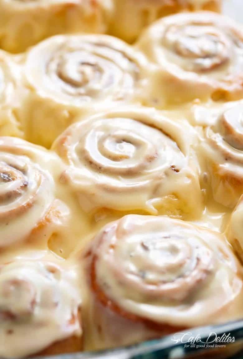 Quick Soft Cinnamon Rolls with a cream cheese glaze are super fluffy and light with a simple homemade dough, and a quick method to get baking! | https://cafedelites.com