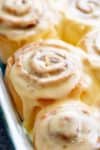 Quick Soft Cinnamon Rolls with a cream cheese glaze are super fluffy and light with a simple homemade dough, and a quick method to get baking! | http://cafedelites.com