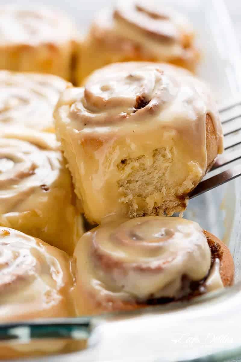 Quick Soft Cinnamon Rolls with a cream cheese glaze are super fluffy and light with a simple homemade dough, and a quick method to get baking! | https://cafedelites.com