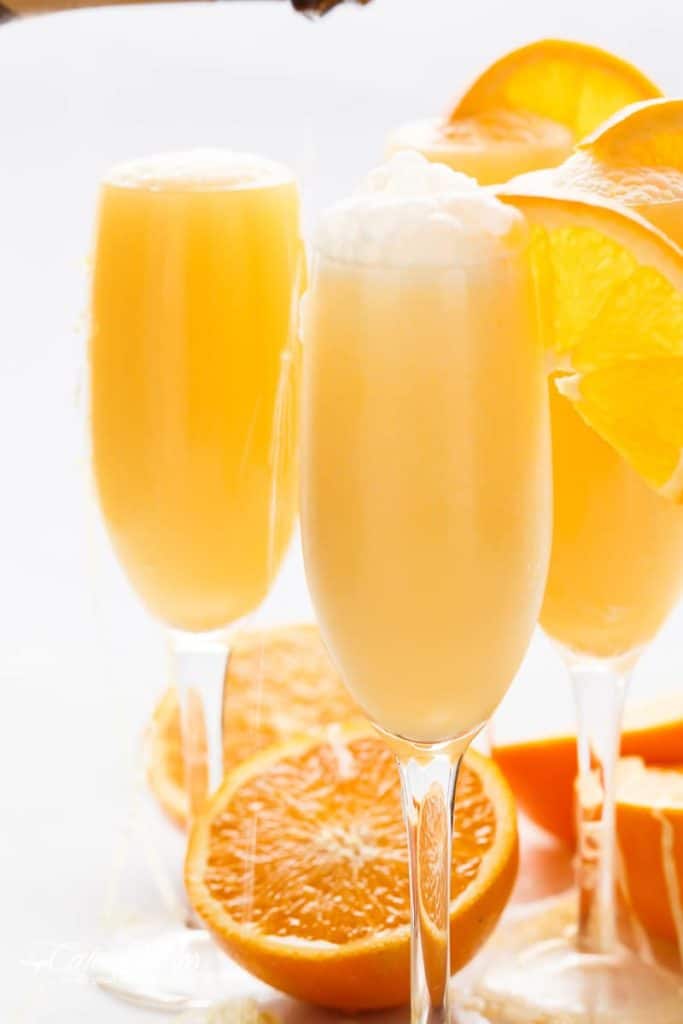 Orange Creamsicle Mimosas is the perfect refreshing beverage to add to your breakfast or brunch menu! A champagne cocktail that tastes just like a Creamsicle! | https://cafedelites.com