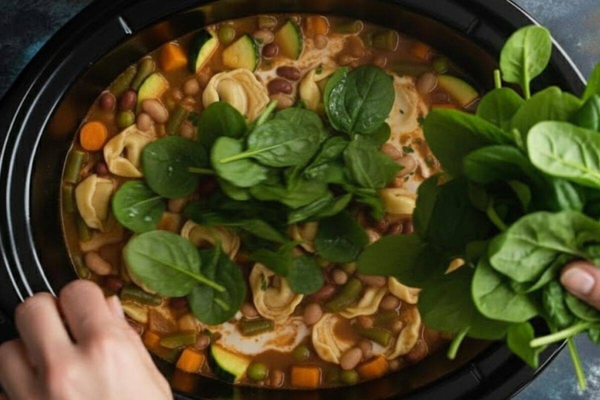 Add in the spinach and cover for about 5 minutes, just until the leaves have wilted and blended into the soup.