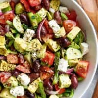 Avocado Greek Salad with a Greek Salad Dressing is a family favourite side salad served with anything! | https://cafedelites.com