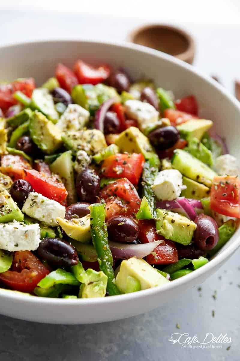 Avocado Greek Salad with a Greek Salad Dressing is a family favourite side salad served with anything! | https://cafedelites.com