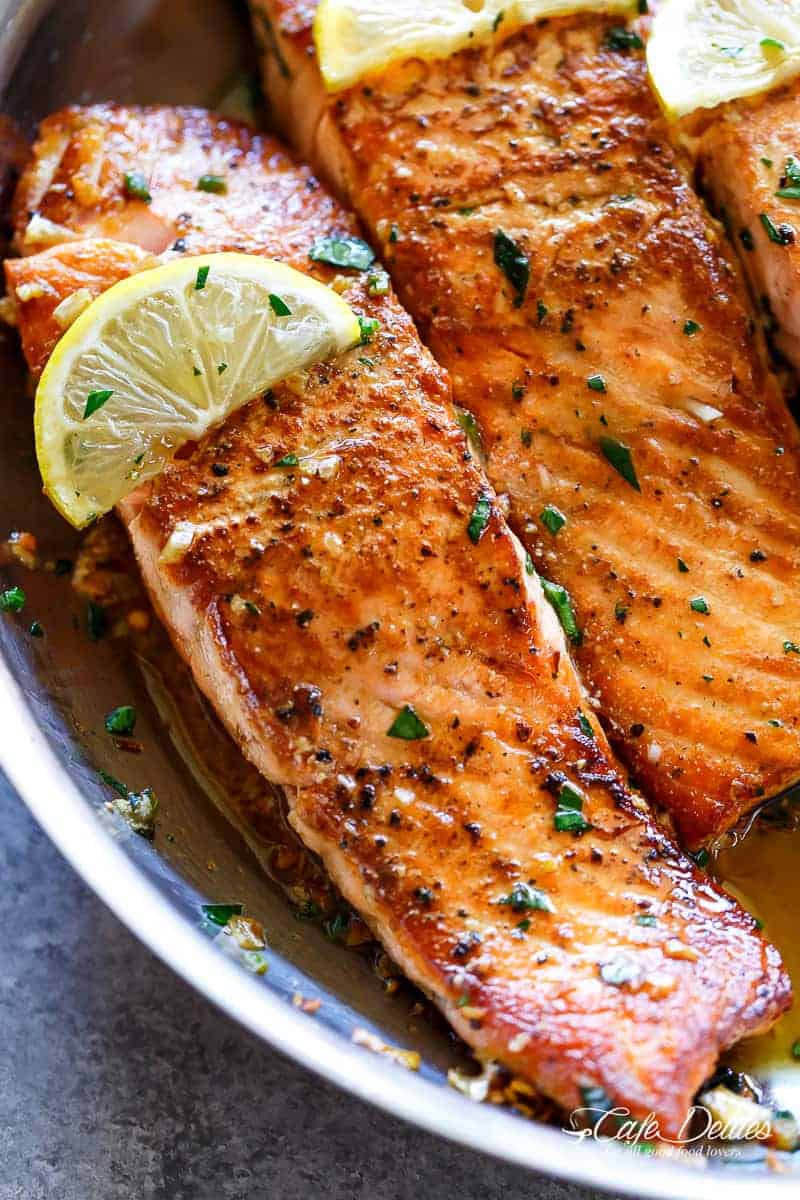 Crispy Seared Lemon Garlic Herb Salmon is a deliciously easy salmon recipe, so simple to make, yet so delicious! Crispy on the outside, soft and tender on the inside! | https://cafedelites.com