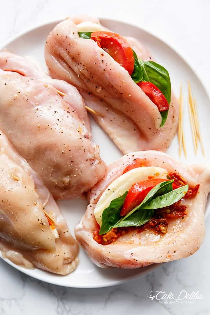 Caprese Stuffed Balsamic Chicken is a twist on Caprese, filled with both fresh AND Sun Dried Tomatoes for a flavour packed chicken! | https://cafedelites.com