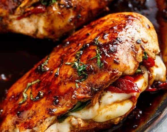 Caprese Stuffed Balsamic Chicken is a twist on Caprese, filled with both fresh AND Sun Dried Tomatoes for a flavor packed chicken!