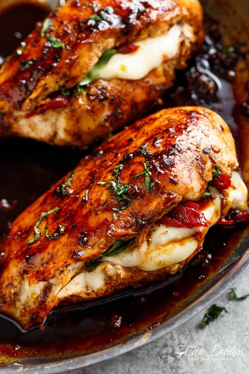 Caprese Stuffed Balsamic Chicken is a twist on Caprese, filled with both fresh AND Sun Dried Tomatoes for a flavour packed chicken! | https://cafedelites.com