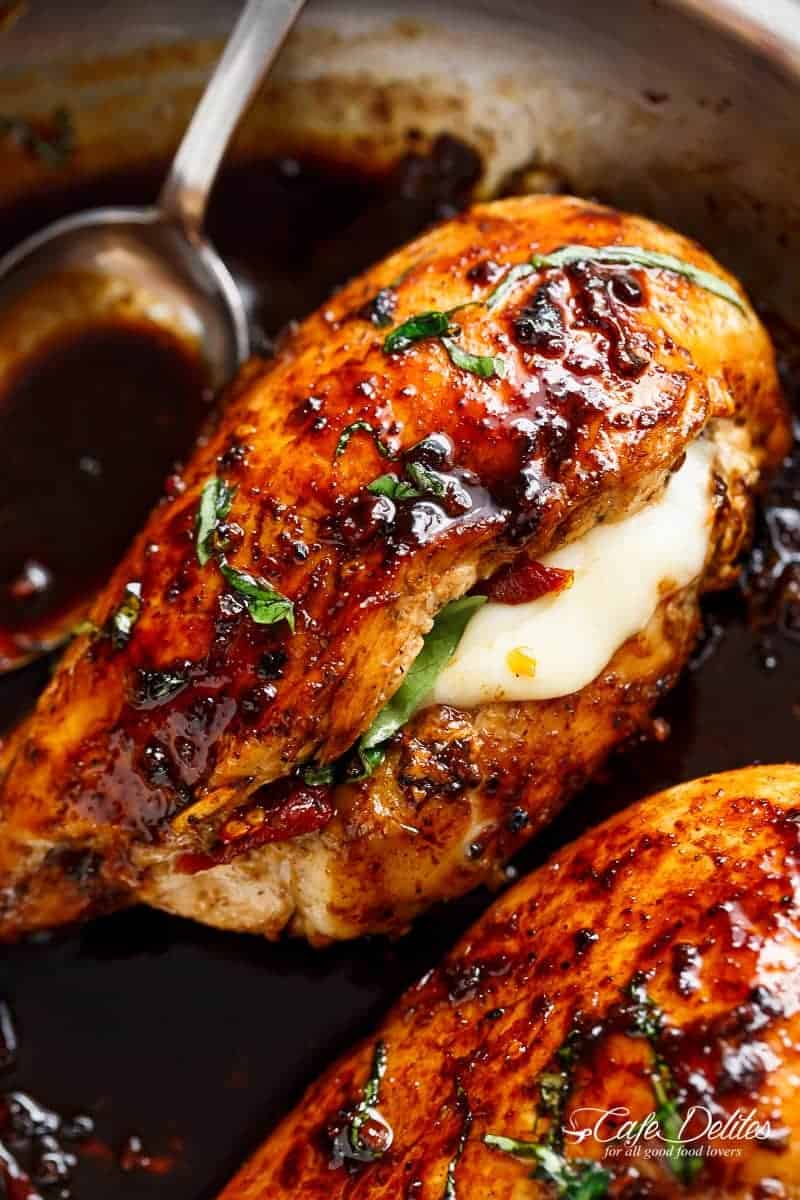 Caprese Stuffed Balsamic Chicken is a twist on Caprese, filled with both fresh AND Sun Dried Tomatoes for a flavour packed chicken! | https://cafedelites.com