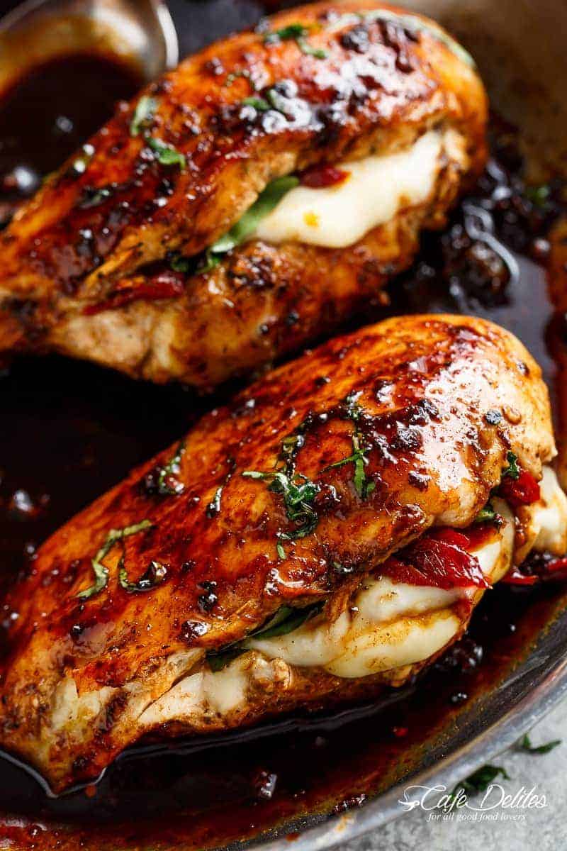 Caprese Stuffed Balsamic Chicken is a twist on Caprese, filled with both fresh AND Sun Dried Tomatoes for a flavour packed chicken! | https://cafedelites.com