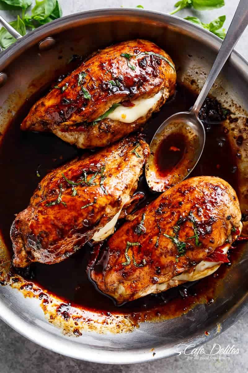 Caprese Stuffed Balsamic Chicken is a twist on Caprese, filled with both fresh AND Sun Dried Tomatoes for a flavour packed chicken! | https://cafedelites.com