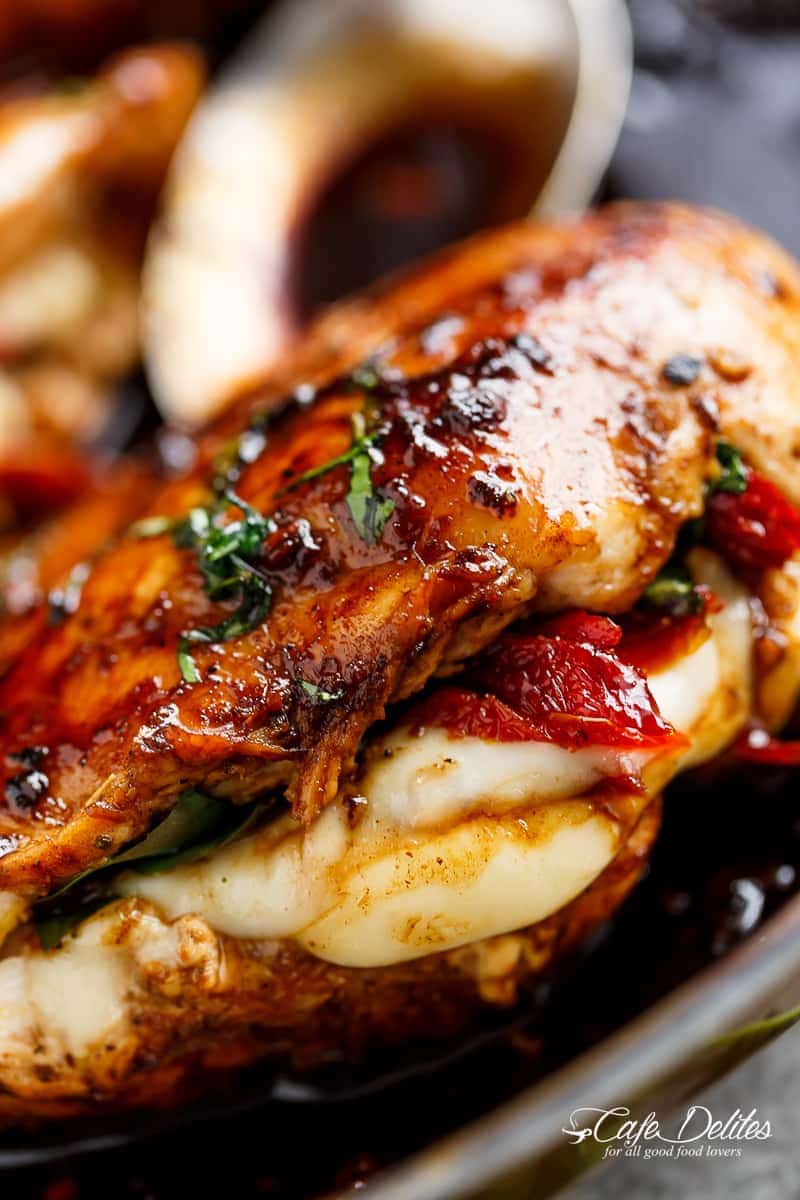 Caprese Stuffed Balsamic Chicken is a twist on Caprese, filled with both fresh AND Sun Dried Tomatoes for a flavour packed chicken! | https://cafedelites.com