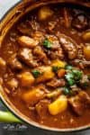 Beef And Guinness Stew is a heart warming bowl of comfort! Oven slow cooked beef, simmered in a rich Guinness gravy, with so much flavour! | https://cafedelites.com