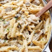 Seared chicken strips mixed through this One-Pot Creamy Mushroom Chicken Pasta, with garlic, mushrooms AND parmesan cheese