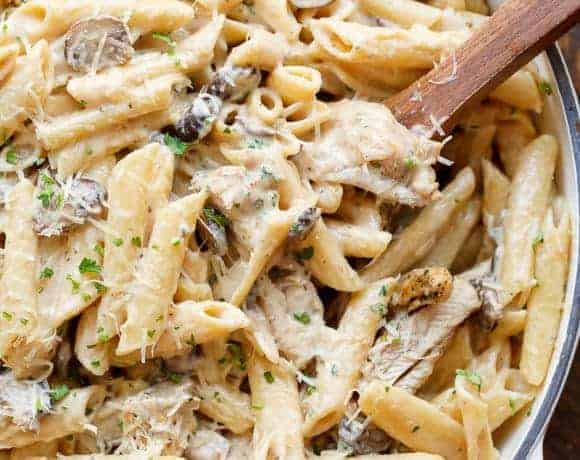 Seared chicken strips mixed through this One-Pot Creamy Mushroom Chicken Pasta, with garlic, mushrooms AND parmesan cheese