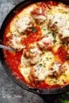 Mozzarella Meatballs In Tomato Sauce are juicy and soft meatballs, simmered in a homemade tomato sauce and topped with melted mozzarella! | https://cafedelites.com