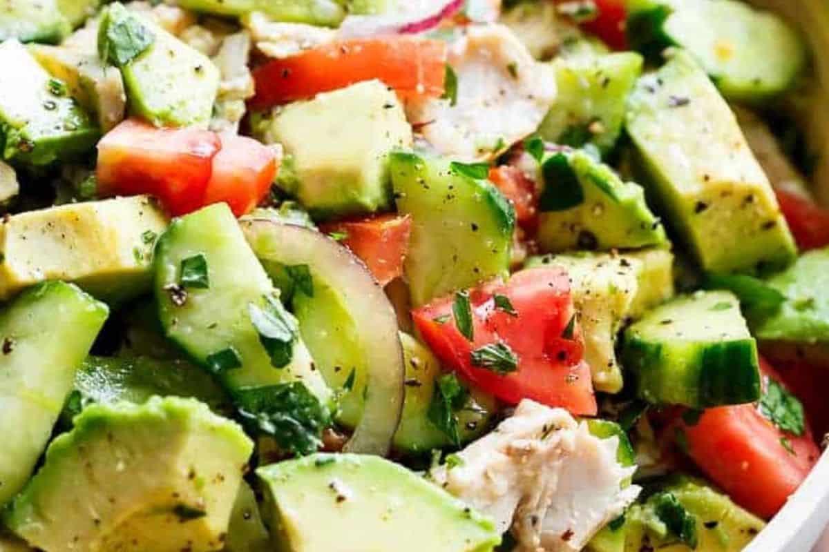 Drizzle the salad with olive oil and lemon or lime juice, then season with salt and pepper. Gently toss to coat everything