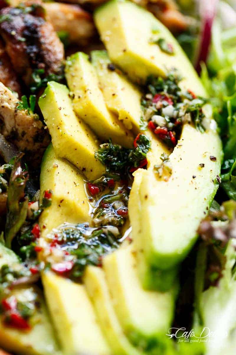 Grilled Chimichurri Chicken Avocado Salad is another meal in a salad! Using authentic chimichurri as a dressing that doubles as a marinade! | https://cafedelites.com