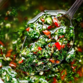 Authentic Chimichurri from Uruguay & Argentina is the best accompaniment to any barbecued or grilled meats! Also used to serve as a dressing on salads! | https://cafedelites.com
