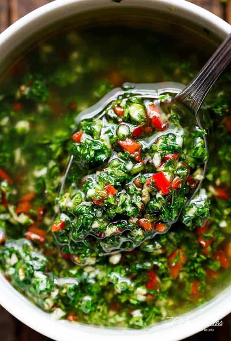 Authentic Chimichurri from Uruguay & Argentina is the best accompaniment to any barbecued or grilled meats! Also used to serve as a dressing on salads! | https://cafedelites.com