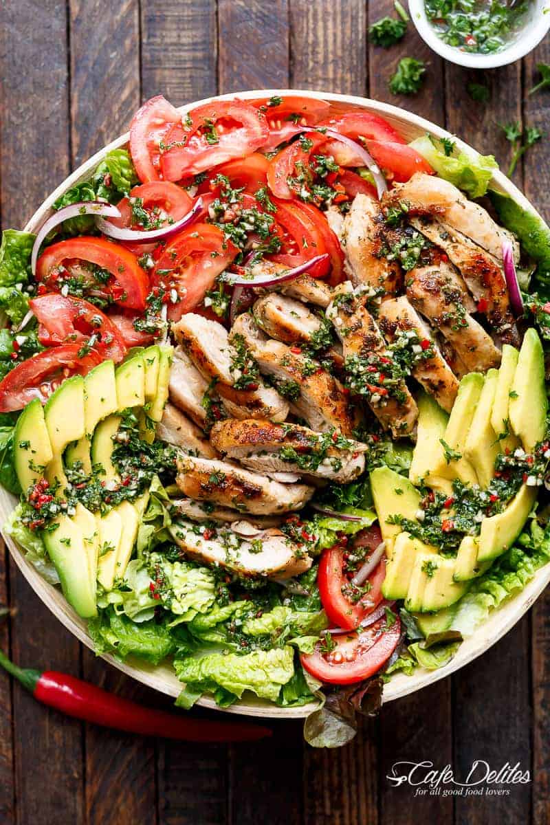 Grilled Chimichurri Chicken Avocado Salad is another meal in a salad! Using authentic chimichurri as a dressing that doubles as a marinade! | https://cafedelites.com