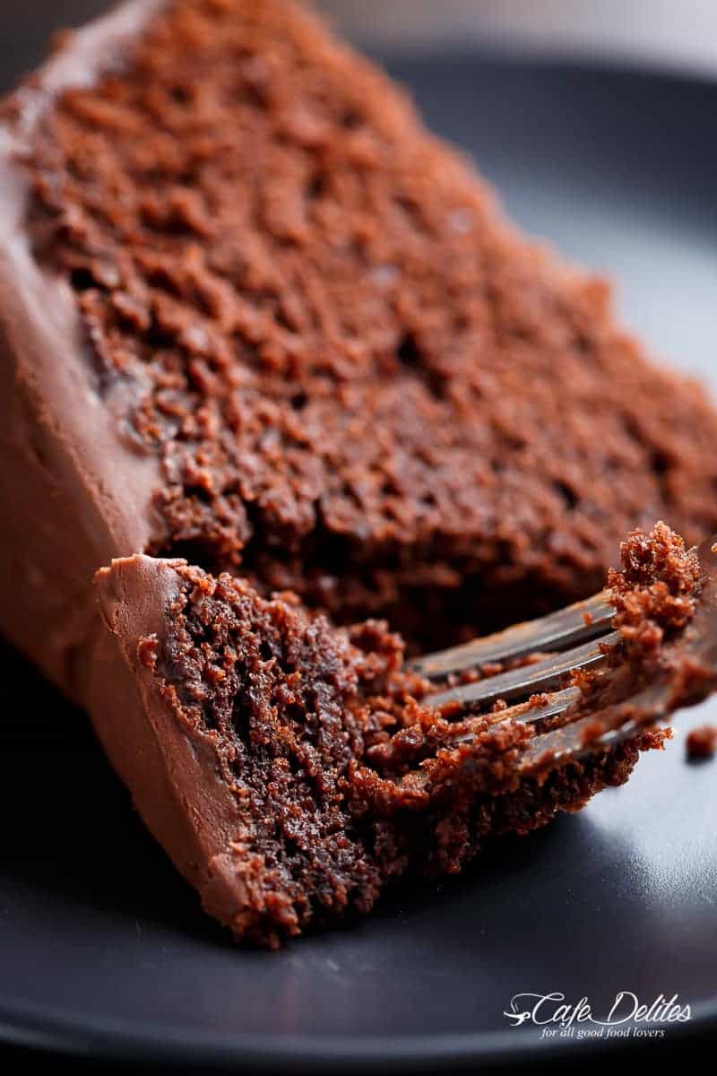 Fork pierced into a slice of Fudgy Chocolate Cake