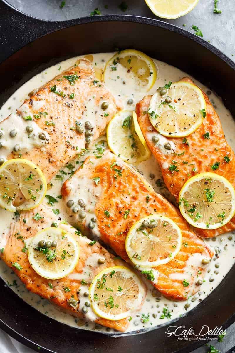 Creamy Lemon Garlic Salmon Piccata is a classy yet easy salmon recipe you've been waiting for, with a delicious creamy lemon caper sauce! | https://cafedelites.com