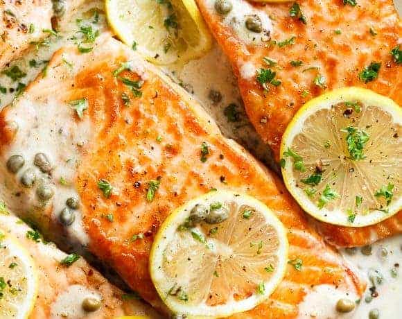 Creamy Lemon Garlic Salmon Piccata is a classy yet easy salmon recipe you've been waiting for, with a delicious creamy lemon caper sauce!