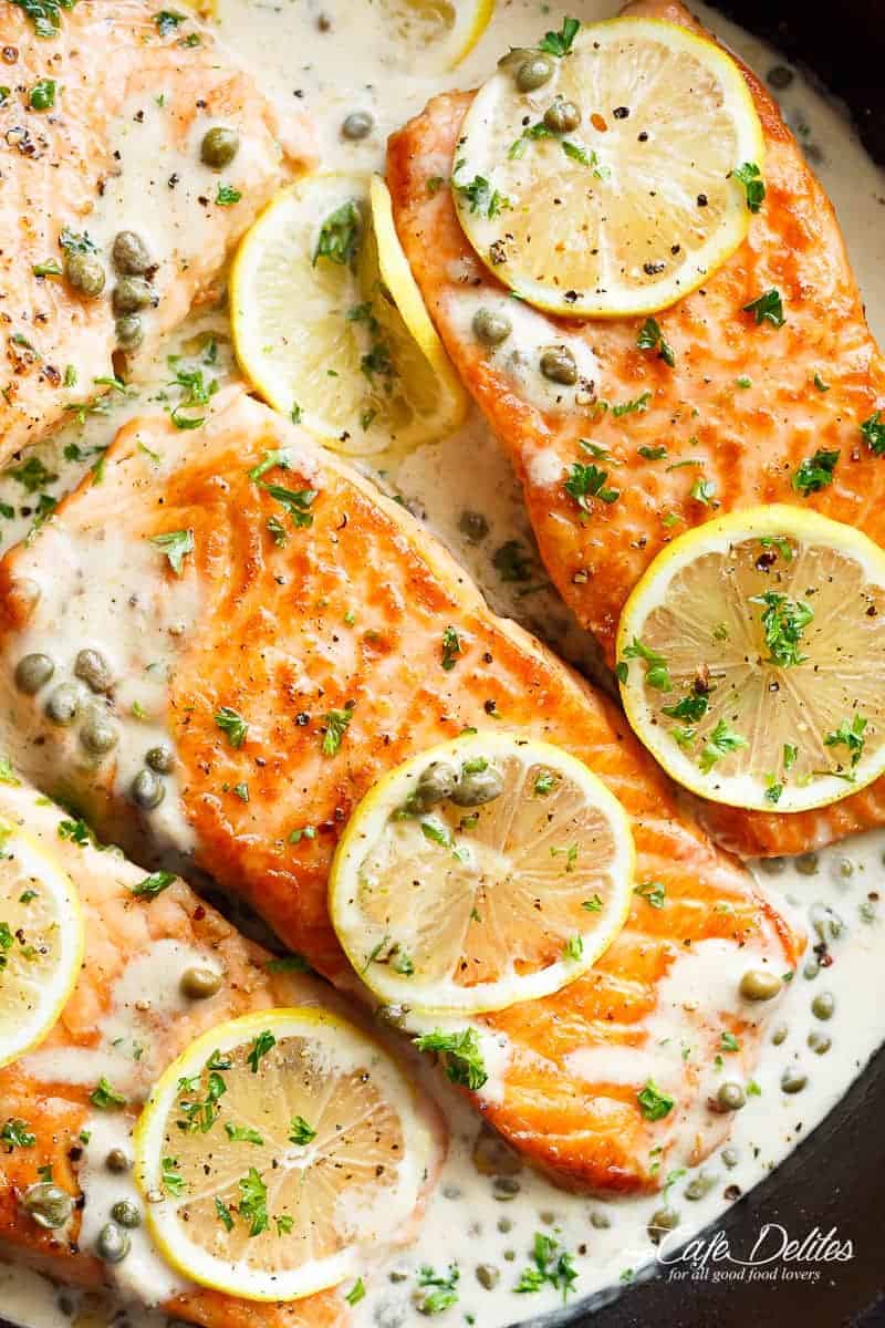 Creamy Lemon Garlic Salmon Piccata is a classy yet easy salmon recipe you've been waiting for, with a delicious creamy lemon caper sauce! | https://cafedelites.com