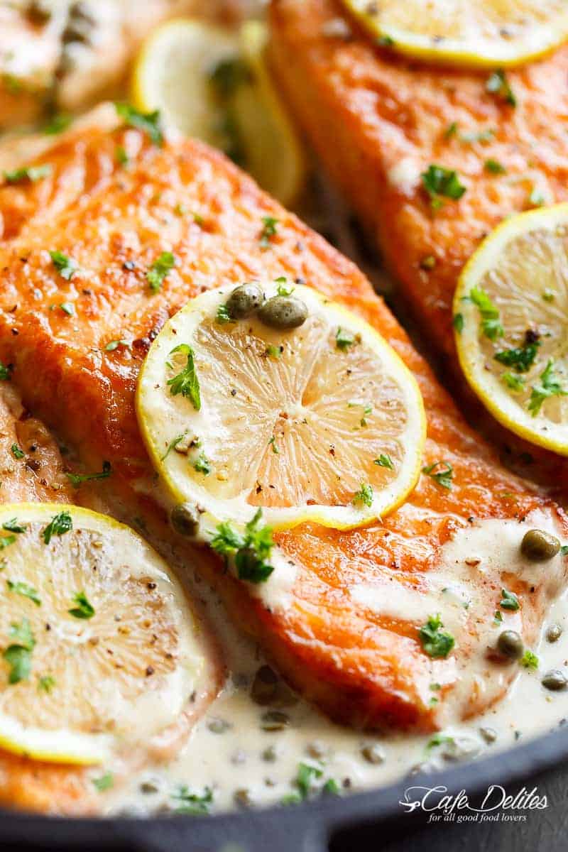 Creamy Lemon Garlic Salmon Piccata is a classy yet easy salmon recipe you've been waiting for, with a delicious creamy lemon caper sauce! | https://cafedelites.com
