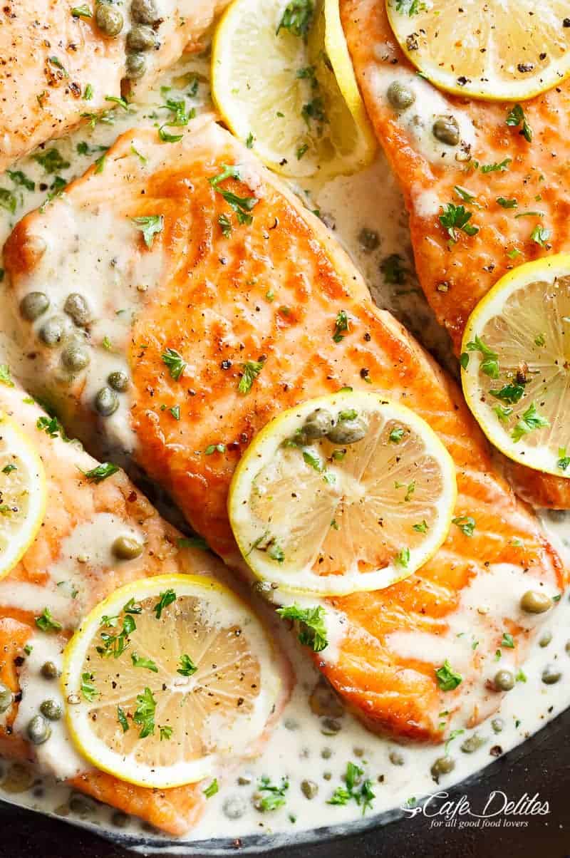 Creamy Lemon Garlic Salmon Piccata is a classy yet easy salmon recipe you've been waiting for, with a delicious creamy lemon caper sauce! | https://cafedelites.com