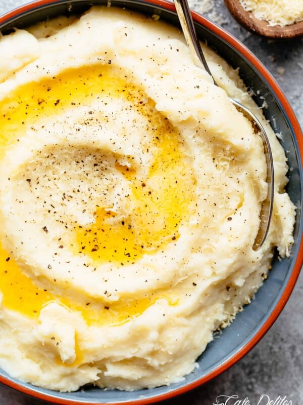 Creamy, buttery Mashed Cauliflower with Garlic, Sour Cream and Parmesan .