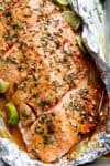 Honey Lime Garlic Butter Salmon in foil Is ready in under 30 MINUTES! Caramelized on the outside and falling apart tender on the inside! | https://cafedelites.com