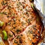 Honey Lime Garlic Butter Salmon in foil Is ready in under 30 MINUTES! Caramelized on the outside and falling apart tender on the inside! | https://cafedelites.com
