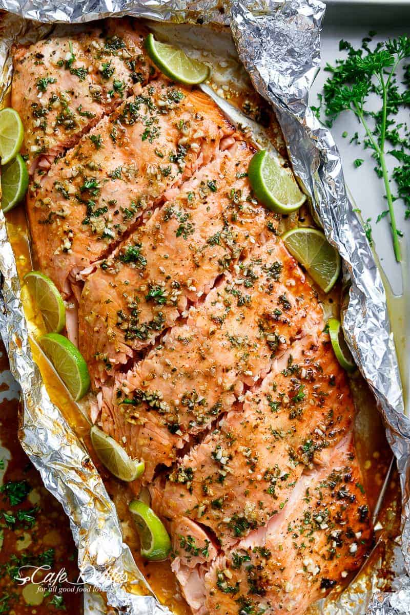 Honey Lime Garlic Butter Salmon in foil Is ready in under 30 MINUTES! Caramelized on the outside and falling apart tender on the inside! | https://cafedelites.com