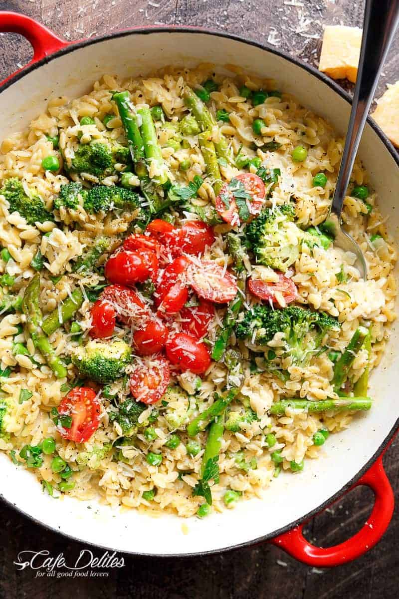 One Pot Orzo Primavera is full of green vegetables and a beautiful sauce with a hint of cream, garlic and lemon! All cooked in the one pan! | https://cafedelites.com