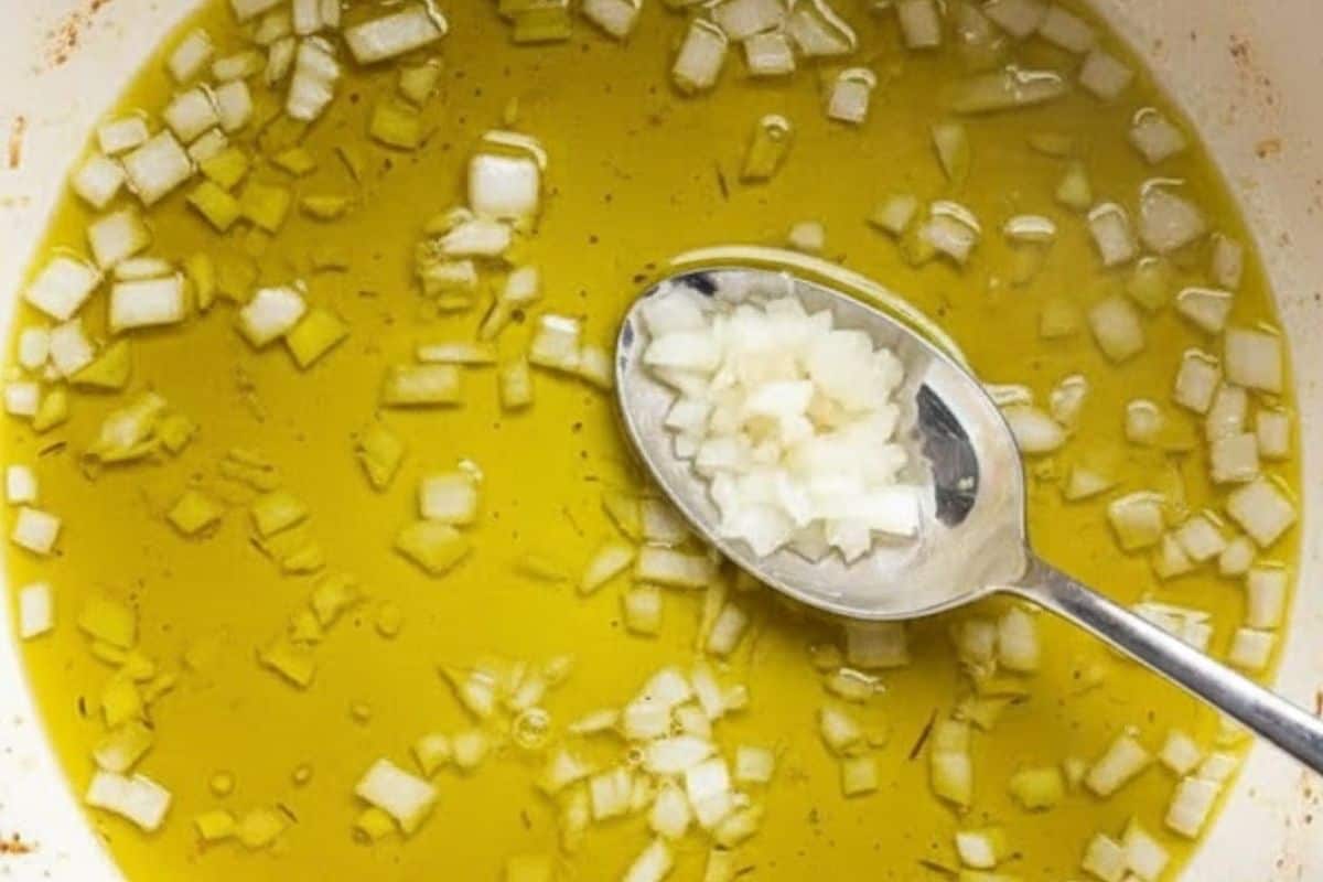 Heat olive oil in a large pot over medium hear and fry chopped onion. Cook for 2-3 minutes.