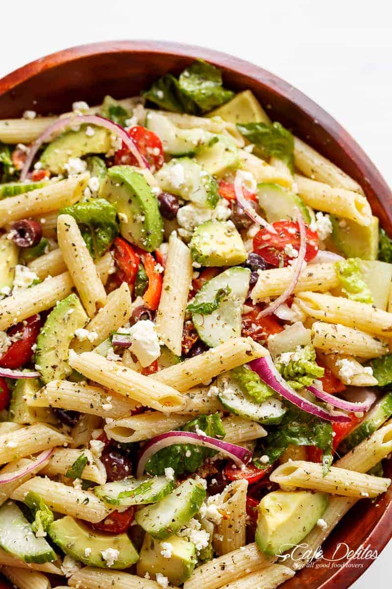 Lemon Herb Mediterranean Pasta Salad is loaded with so many Mediterranean salad ingredients, and drizzled an incredible Lemon Herb dressing! | https://cafedelites.com