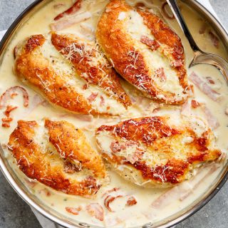 Creamy Parmesan Carbonara Chicken is the ultimate twist! Crispy, golden chicken fillets in a carbonara inspired sauce for a new favourite chicken recipe! | https://cafedelites.com