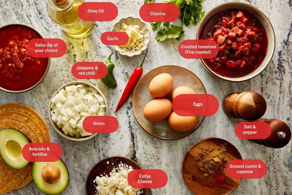 a top down view of all the ingredients needed to make huevos rancheros in individual bowls and plates. - 4