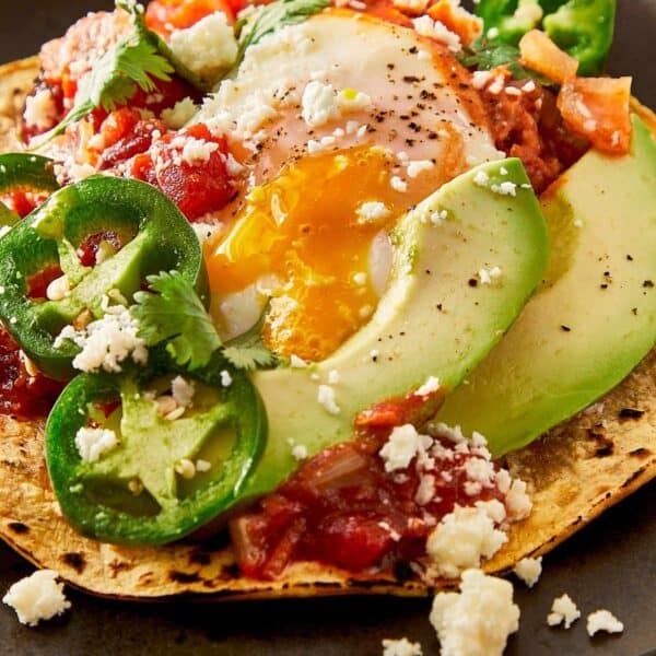 a close up top down view of a fully cooked huevos rancheros