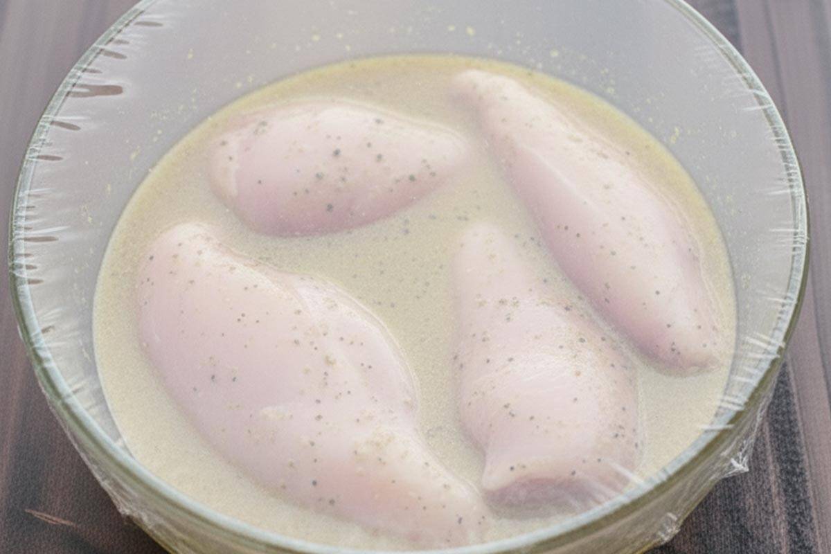 Marinating the chicken.