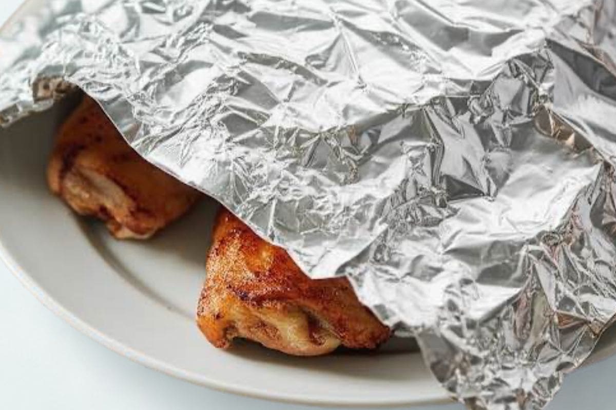 Transfer the cooked chicken into a warm plate. Tent with foil and allow the chicken to rest.