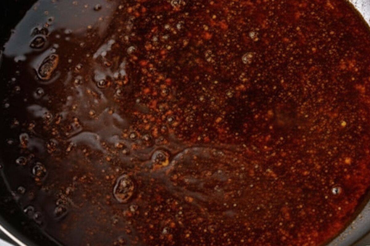 Pour marinade into the hot pan and simmer until warmed through