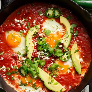 Easy Huevos Rancheros are done so fast, with an added, non traditional secret-ingredient weapon that guarantees amazing flavours! | https://cafedelites.com