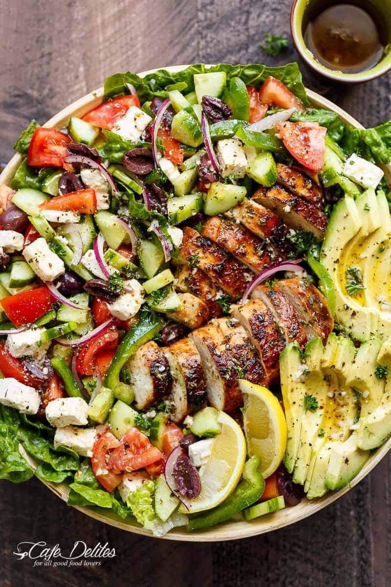 Loaded Greek Chicken Avocado Salad is another meal in a salad! Full of Greek flavours and a 5-ingredient dressing that doubles as a marinade! | https://cafedelites.com