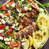 Loaded Greek Chicken Avocado Salad is another meal in a salad! Full of Greek flavours and a 5-ingredient dressing that doubles as a marinade! | https://cafedelites.com