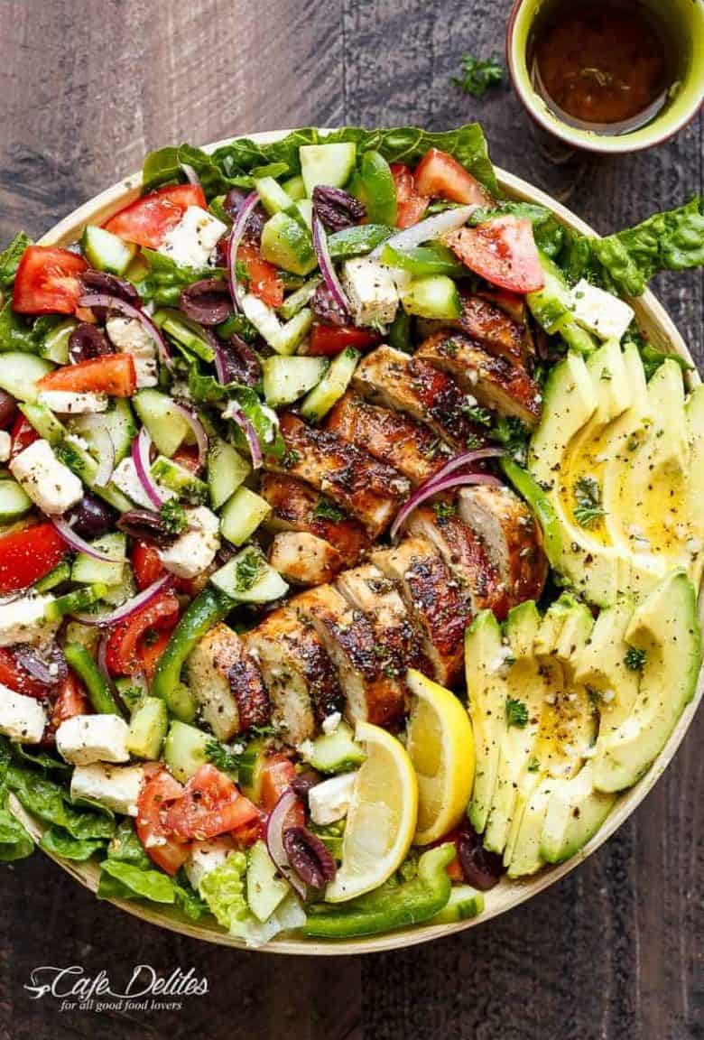 Loaded Greek Chicken Avocado Salad is another meal in a salad! Full of Greek flavours and a 5-ingredient dressing that doubles as a marinade! | https://cafedelites.com